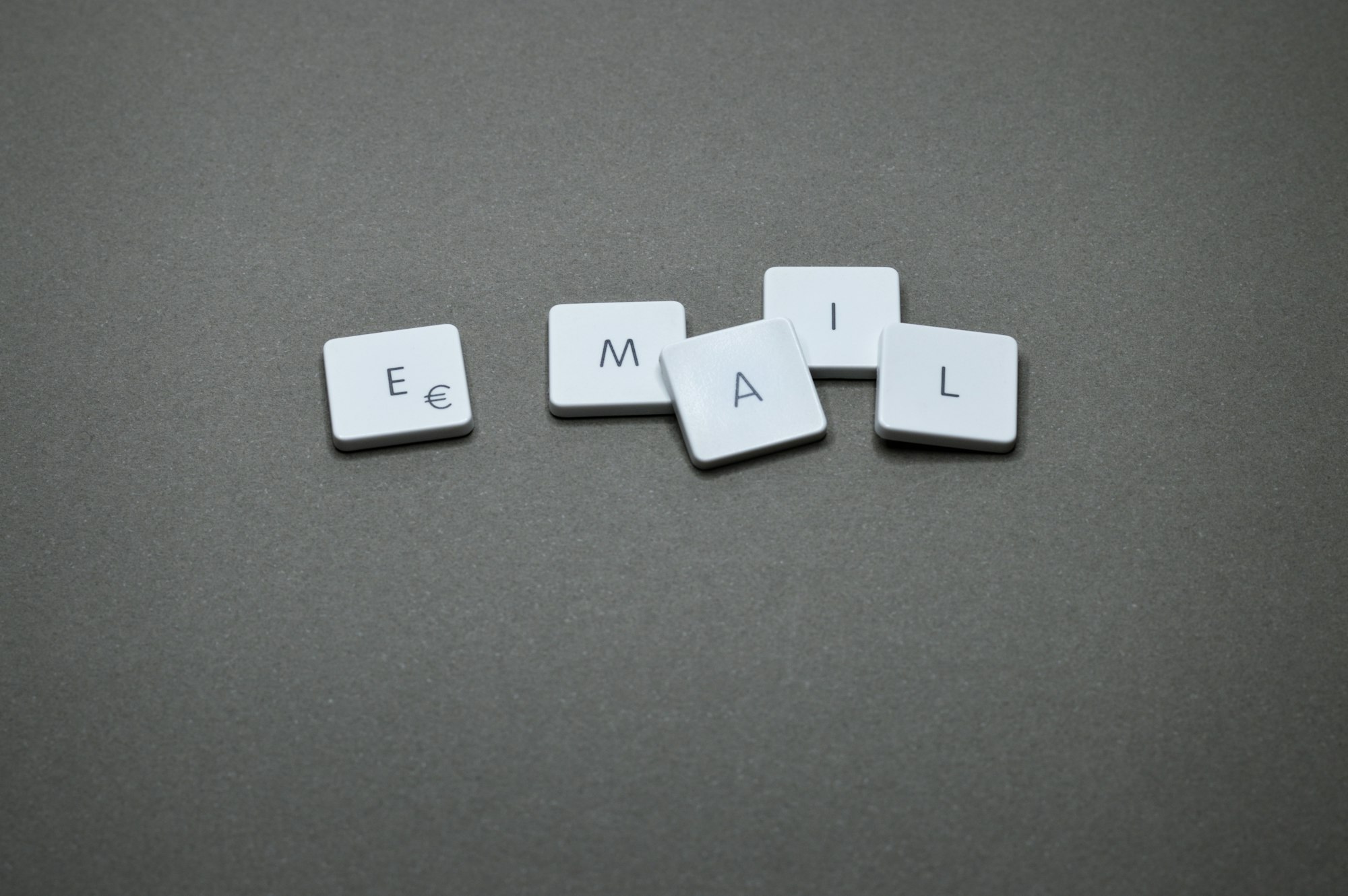 The word "email" is spelled out with letter tiles