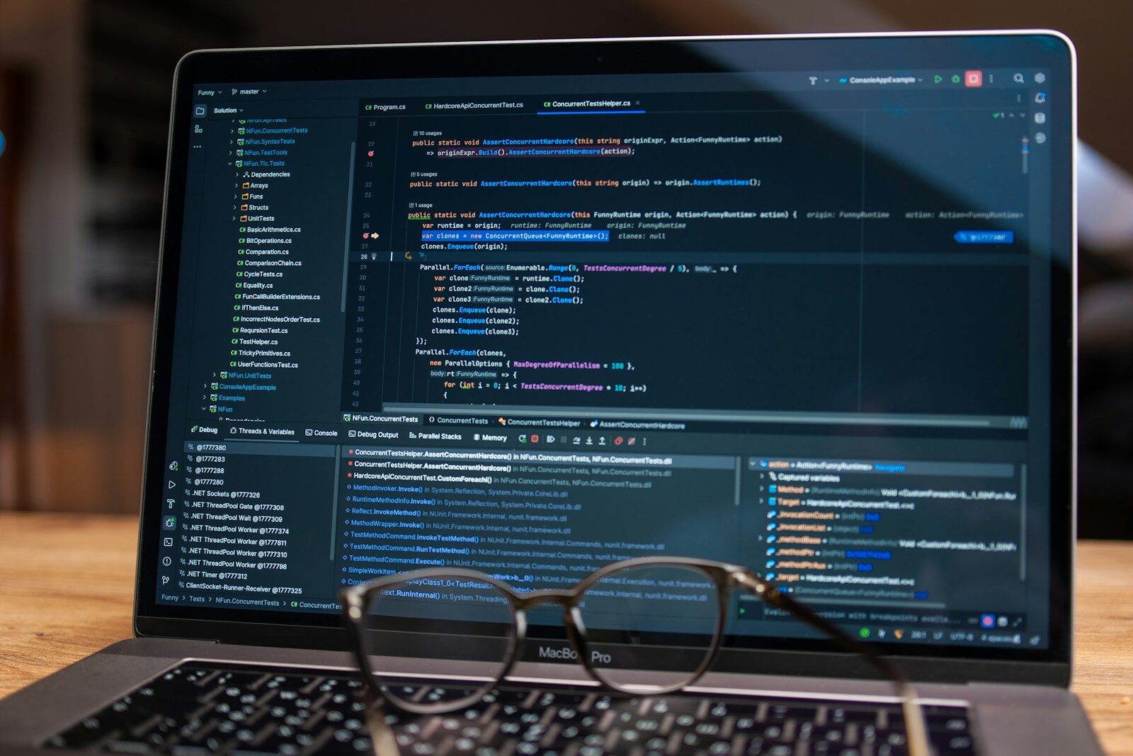 Laptop screen displaying lines of code with glasses