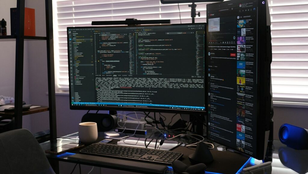 a computer monitor sitting on top of a desk
